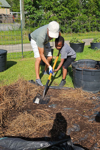 Boys and Girls Club working in garden