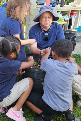Boys and Girls Club working in garden