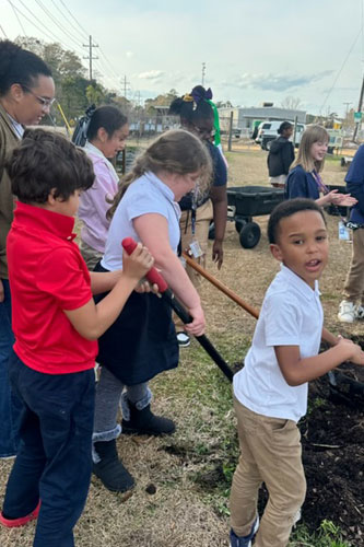Boys and Girls Club working in garden